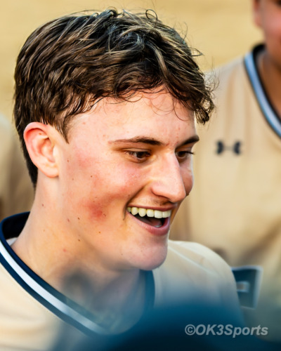 Forestville, MD — Jonathan Robinson(#23) of Our Lady of Good Counsel reacts after a home run during a conference matchup against Bishop McNamara. Good Counsel pulled away in the later innings to win 18-10. Photo by Olen Kelley III/OK3Sports
