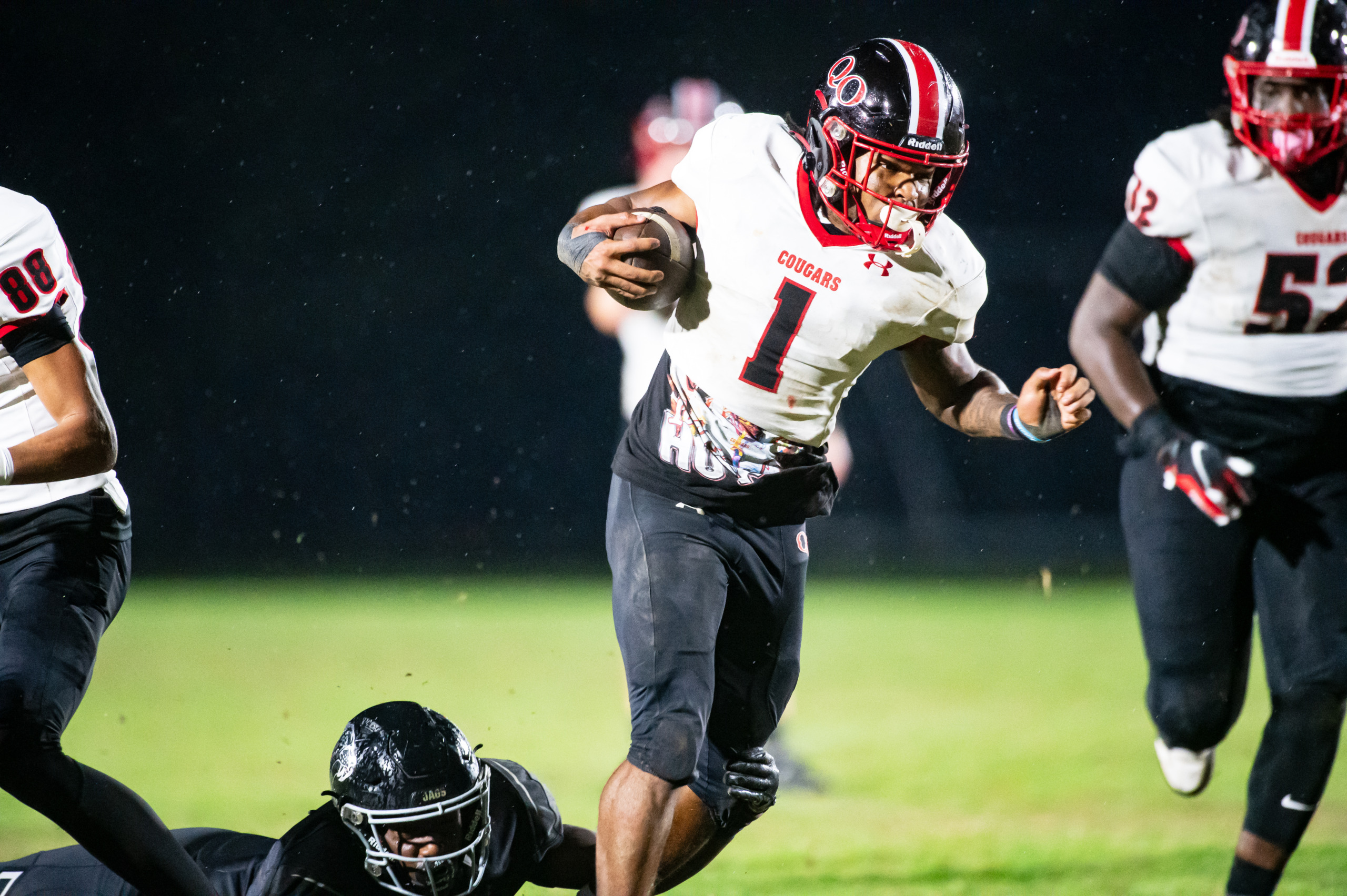 FOOTBALL: Quince Orchard 34, Northwest 21: Howard helps lift the Cougars over the Jaguars