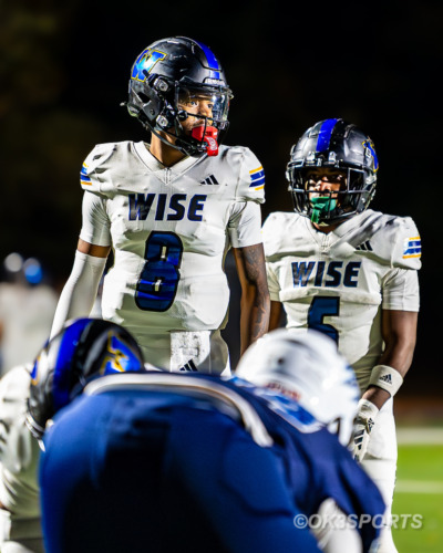 Wise quarterback Eric Wedge III drops back to throw during a 63–0 win over Northwestern, finishing with three touchdown passes and 121 yards through the air.