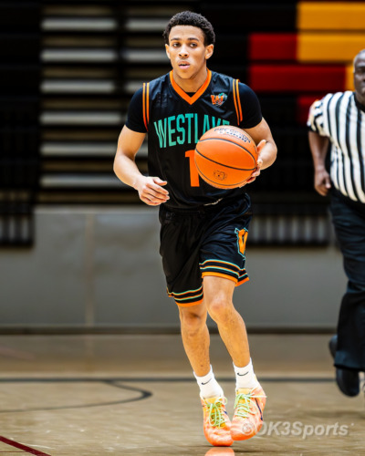 Westlake Wolverines varsity basketball players compete against Springbrook during a 43–42 home win in Waldorf Maryland. Photo by Olen Kelley III OK3Sports.