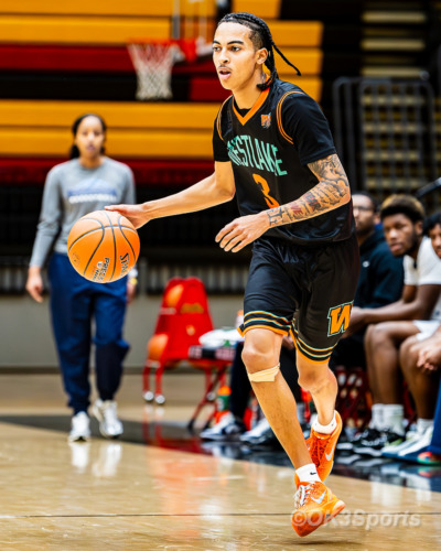 Westlake Wolverines varsity basketball players compete against Springbrook during a 43–42 home win in Waldorf Maryland. Photo by Olen Kelley III OK3Sports.