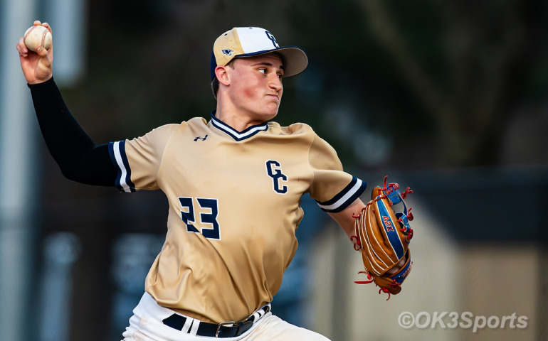 Forestville, MD — Our Lady of Good Counsel’s #23 delivers a pitch during a conference matchup against Bishop McNamara. The Falcons closed strong in the final innings to secure an 18-10 win, with #23 also contributing two home runs at the plate. Photo by Olen Kelley III/OK3Sports