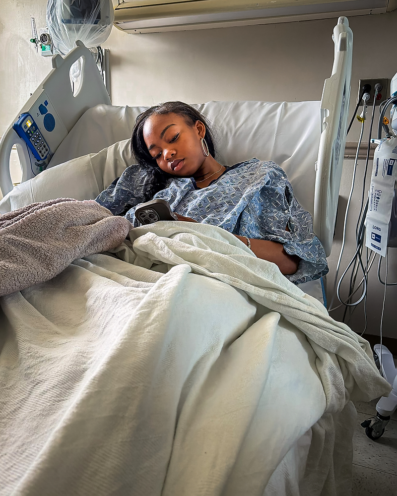 Natalie Kelley rests in a hospital bed after her Type 1 diabetes diagnosis.
