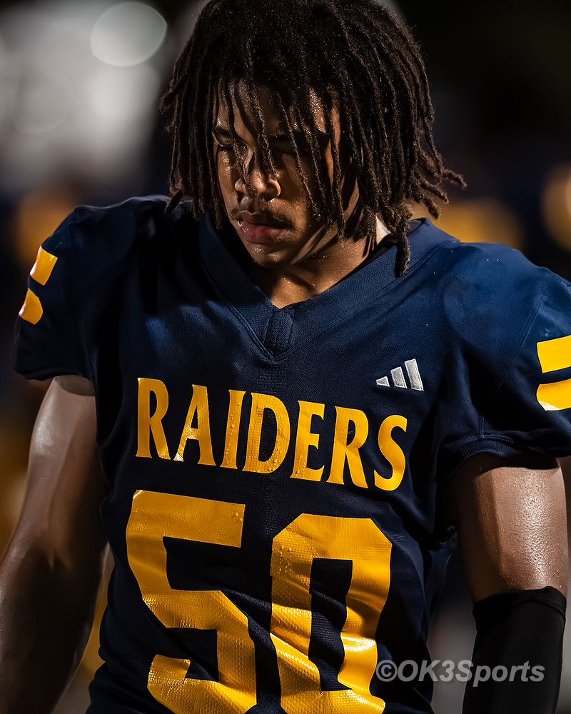  Keenan Raiders football players in action during game against Airport Eagles.