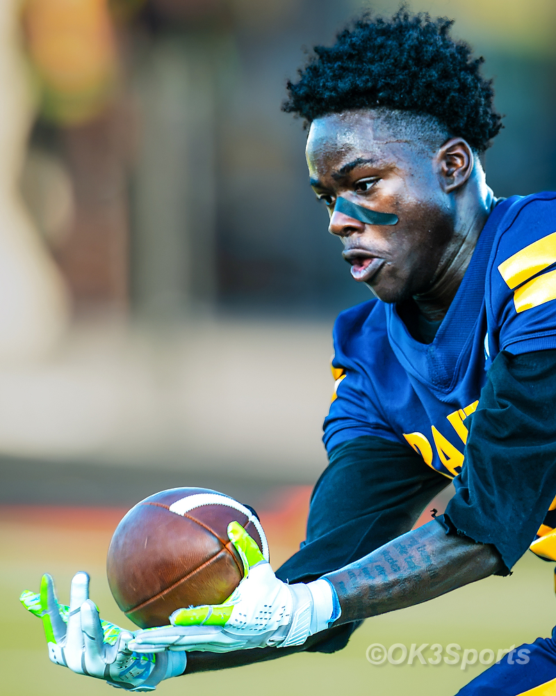  Keenan Raiders football players in action during game against Airport Eagles.