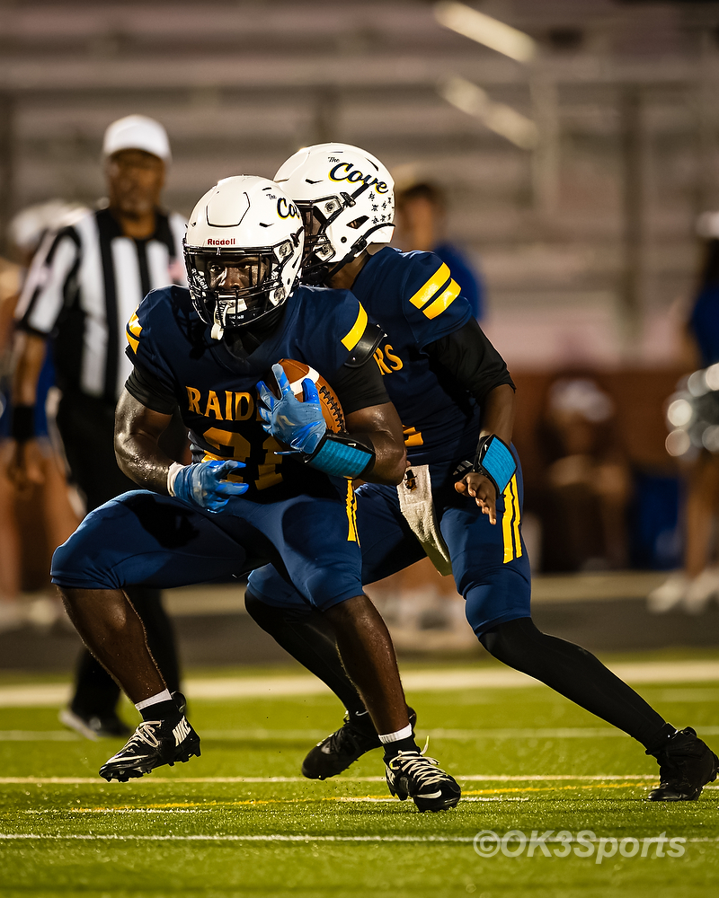 Keenan Raiders running back takes a handoff during the Airport football game