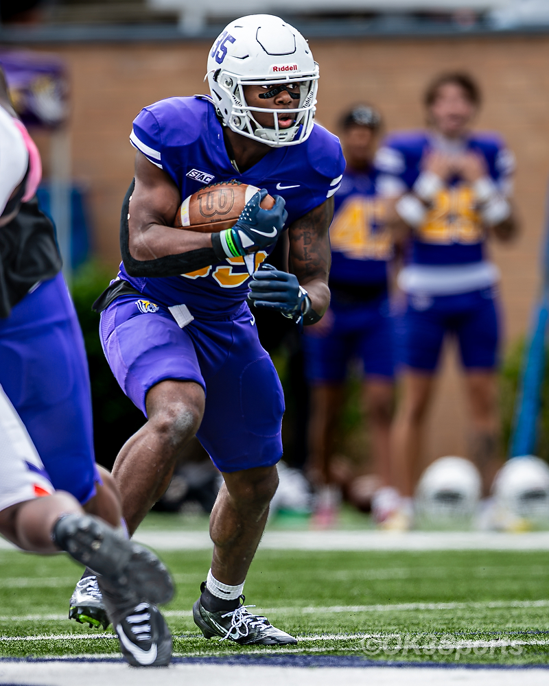 Tigers freshman running back Christopher Johnson runs downhill against Edward Waters.