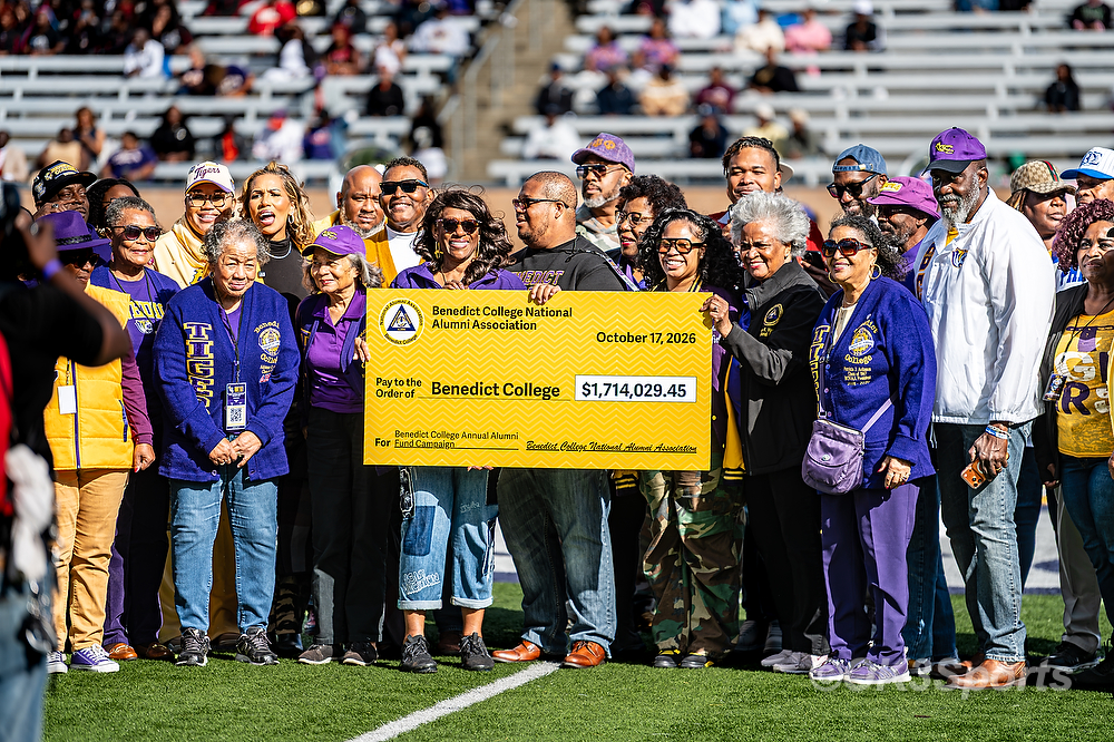 Members of the Benedict College National Alumni Association hold a $1,714,029.45 check made out to Benedict College at Benedict homecoming.